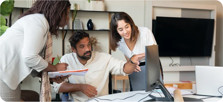 Three people discussing ideas for product photography
