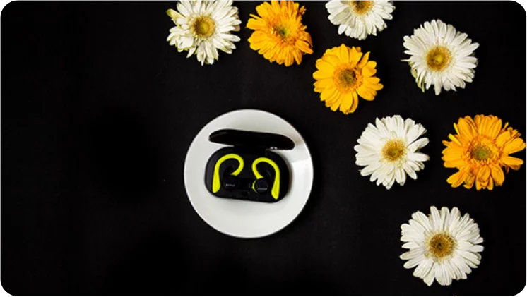 TWS earphones placed in a lifestyle setting to showcase their usability
